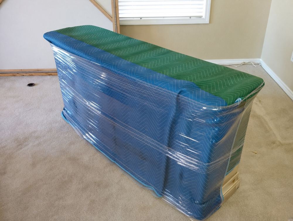 Bench wrapped in moving blankets
